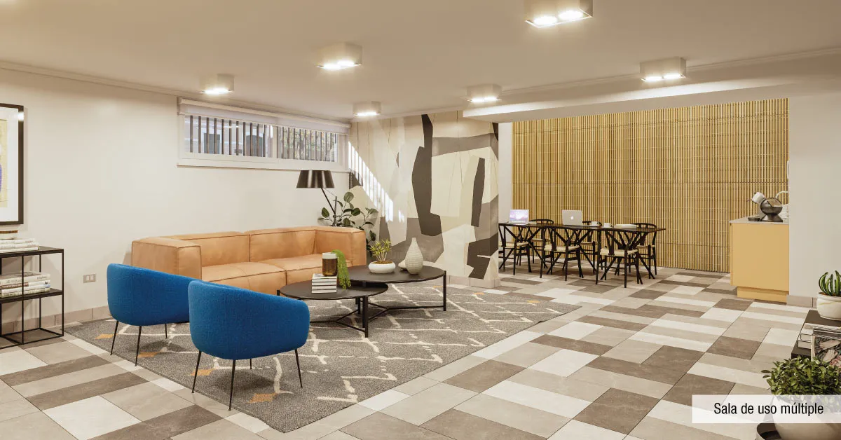 Sala de uso múltiple de Edificio Pedro de la Barra en Santiago Centro, destacando cómodos sectores de estar y mesas.