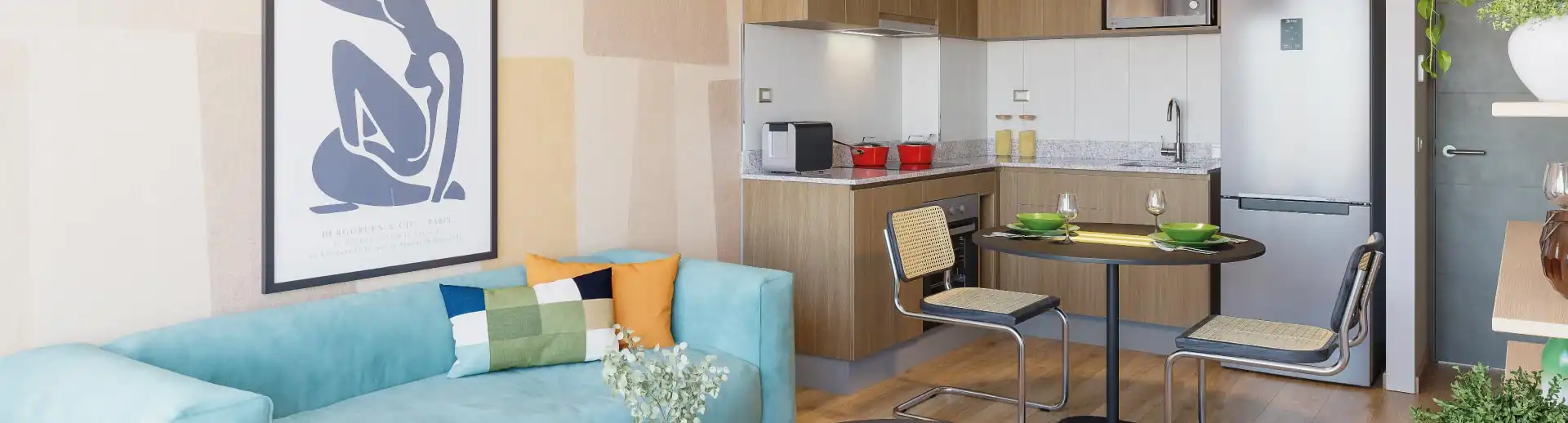 Living y cocina integrada de Condominio Trocadero en Antofagasta, destacando sus muebles con cubierta de granito.