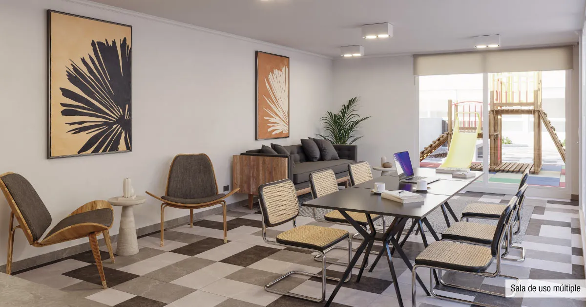 Sala de uso múltiple de Condominio Trocadero en Antofagasta, equipada con cómodos sectores de estar y mesas.