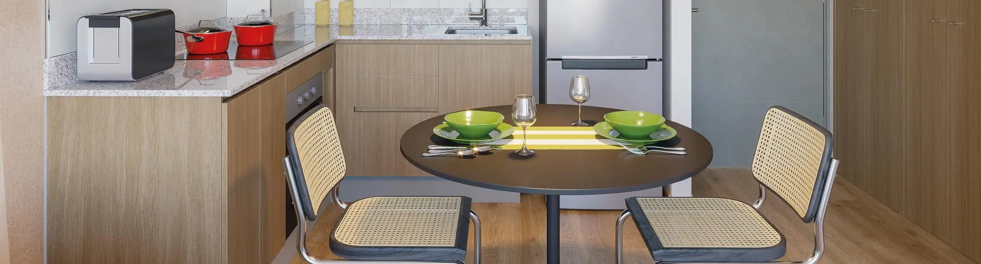 Comedor y cocina de Condominio Trocadero en Antofagasta, destacando el piso vinílico SPC y cubierta de granito.