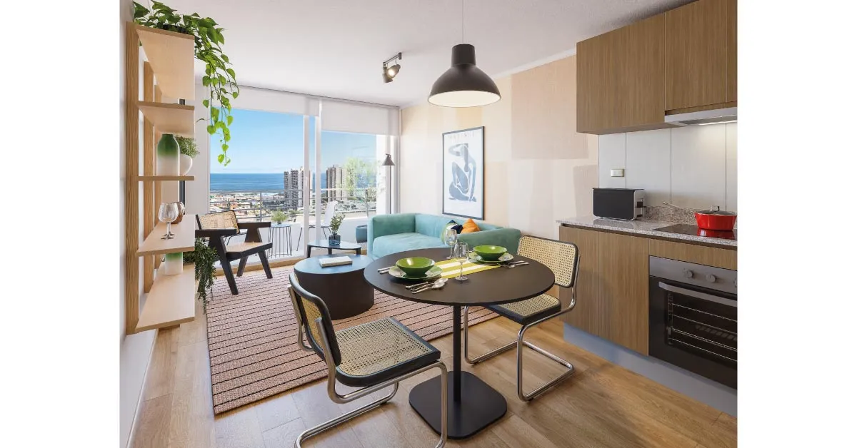Living comedor de Condominio Trocadero en Antofagasta, destacando la cocina equipada con cubierta de granito.