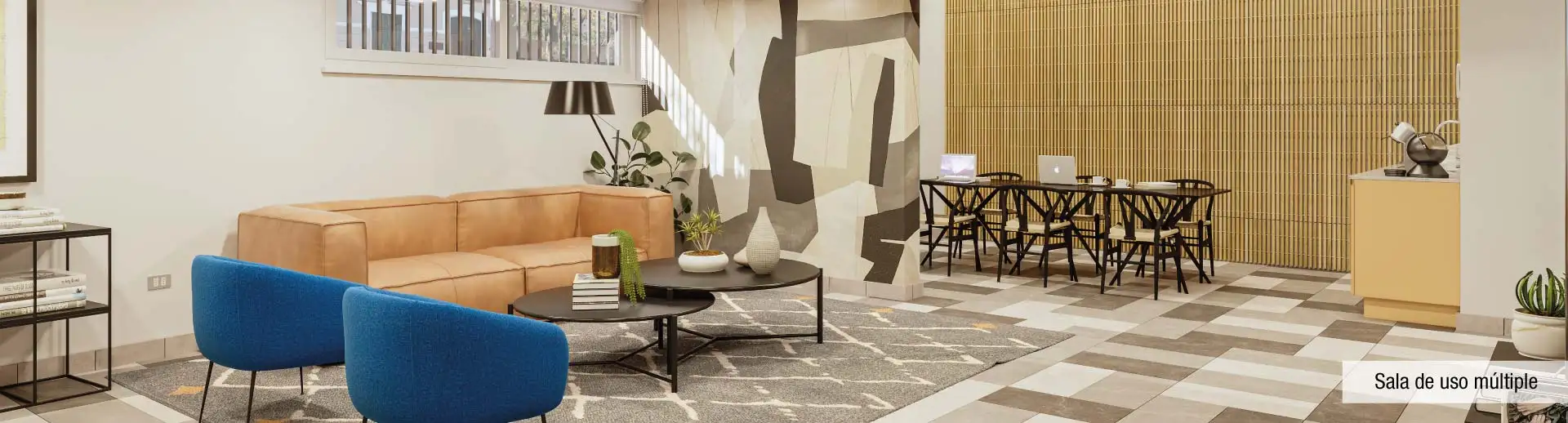 Sala de uso múltiple de Edificio Pedro de la Barra en Santiago Centro, destacando cómodos sectores de estar y mesas.